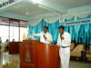 Fredrick praying at the Kannada Service
