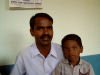 Roger and Simon visit with Pastor Gopi Daniel and family