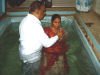 Pastor Jackson baptising people from Pastor Ruby's church