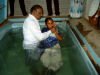 Pastor Jackson baptising people from Pastor Ruby's church