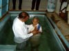 Pastor Jackson baptising people from Pastor Ruby's church