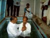 Pastor Jackson baptising people from Pastor Ruby's church
