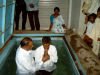 Pastor Jackson baptising people from Pastor Ruby's church