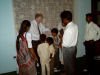 Roger praying for those recently baptised